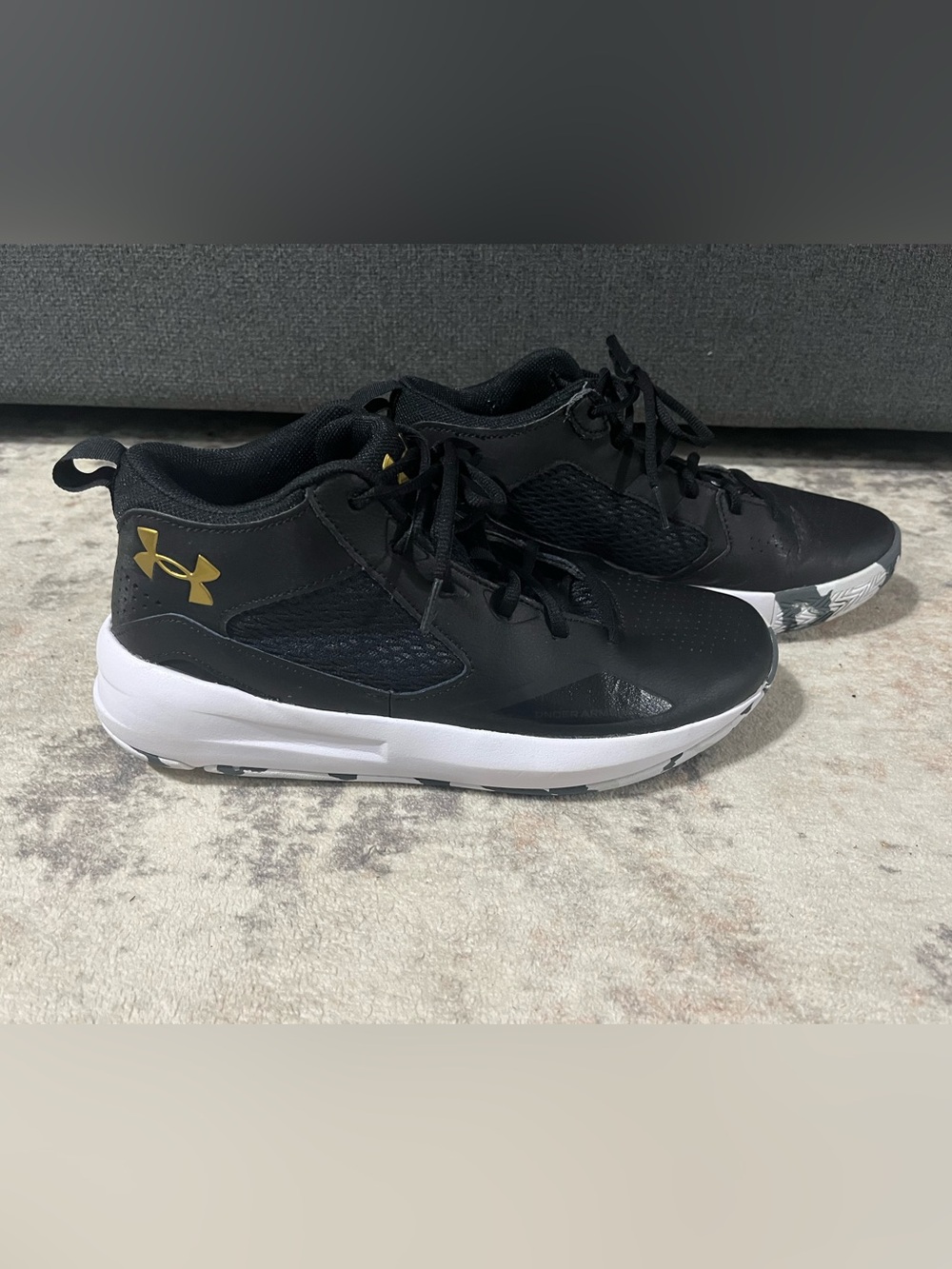 Under Armour men's  Black Sneakers with Gold Logo and White Sole